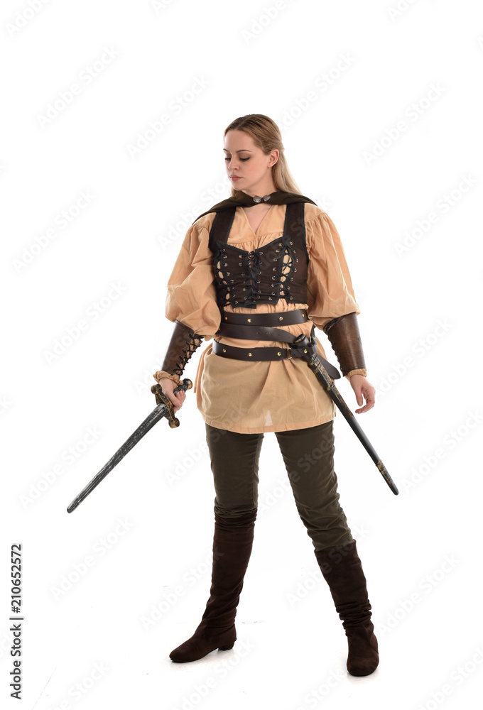 full length portrait of girl wearing brown medieval costume,. standing pose, isolated on white studio background. full length portrait of girl wearing brown medieval costume,. standing pose, isolated on white studio background.