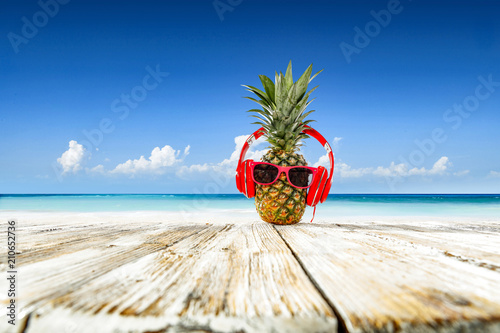 Pineapple on beach and summer time 