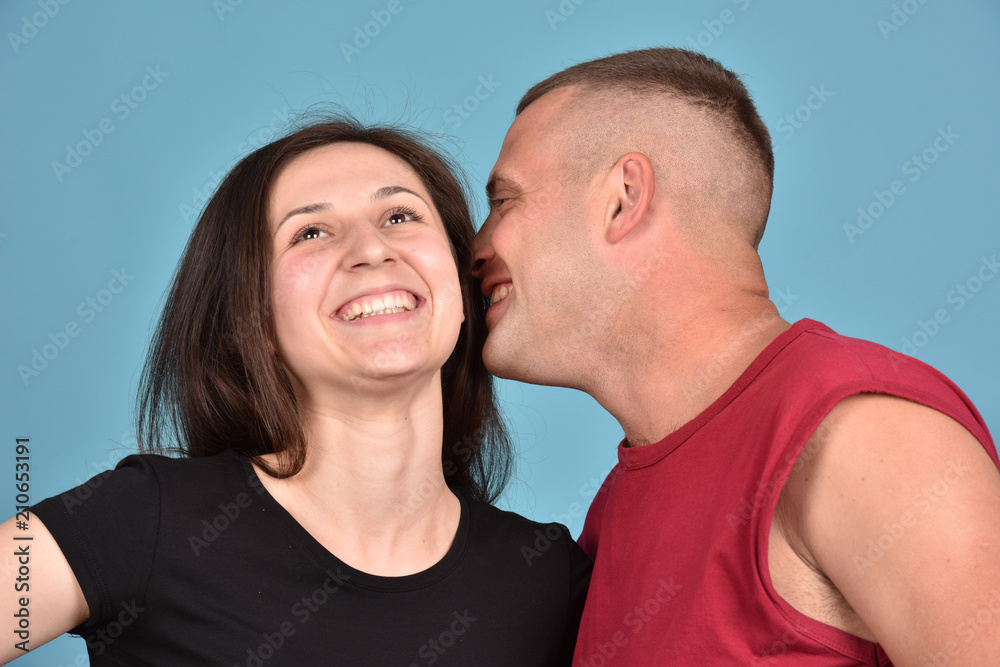 Young family on a blue background. Perfect pair. A good relationship. Strong friendship. Young family on a blue background. Perfect pair. A good relationship. Strong friendship.