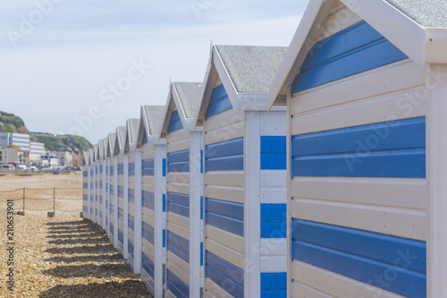 Blue and white striped beach huts at the seaside