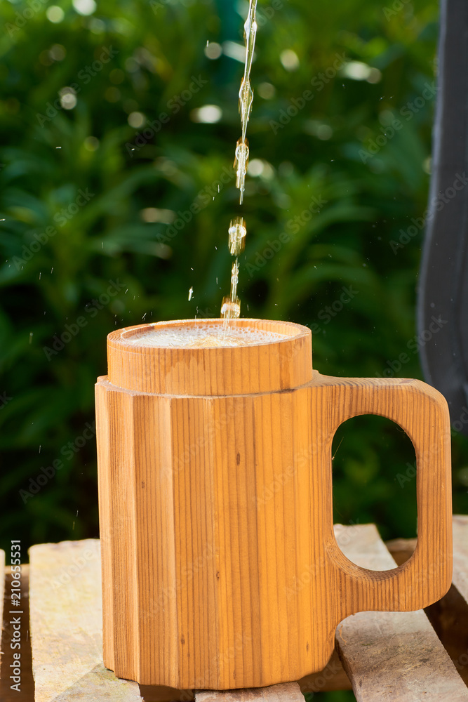 beer in a wooden mug