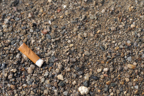 Cigarette but on the ground