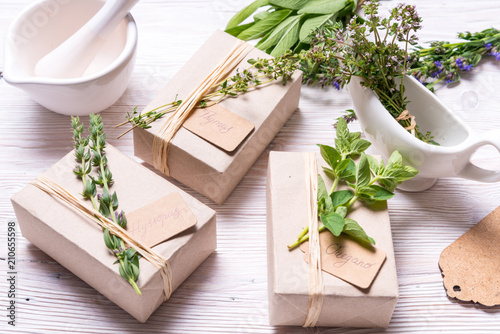 Carton boxes decorated with spices branches on wood table photo