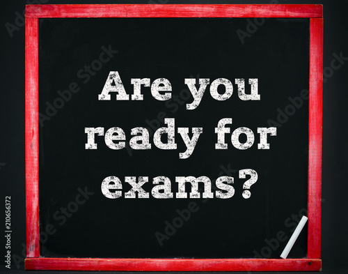 Inscription on a black chalk board: Are you ready for exams?