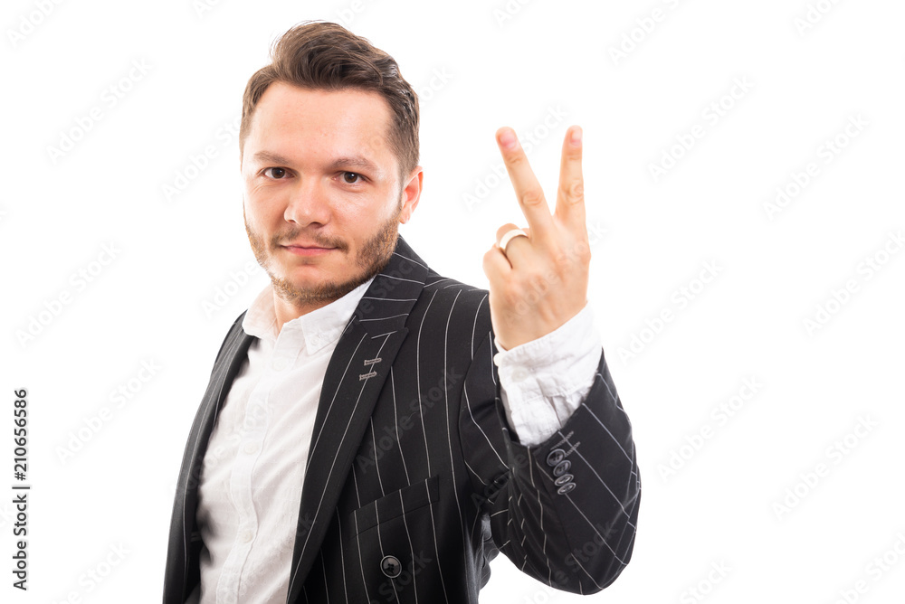 Portrait of business man showing number two. Portrait of business man showing number two.