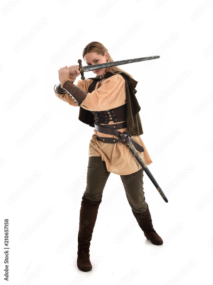 full length portrait of girl wearing brown medieval costume,. standing pose, isolated on white studio background. full length portrait of girl wearing brown medieval costume,. standing pose, isolated on white studio background.