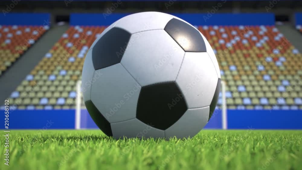 Camera zooms out from an extreme closeup to a soccer ball lying in the