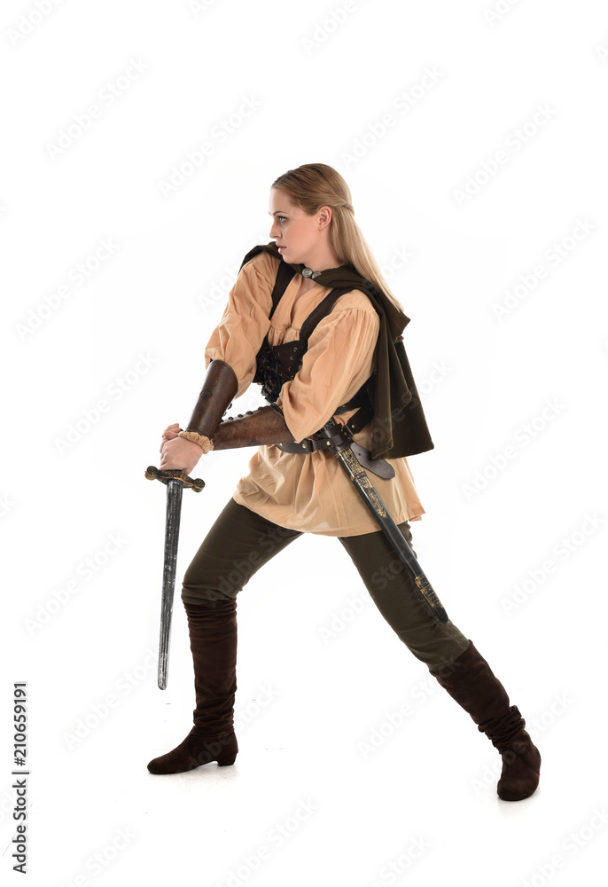 full length portrait of girl wearing brown medieval costume,. standing pose, isolated on white studio background. full length portrait of girl wearing brown medieval costume,. standing pose, isolated on white studio background.