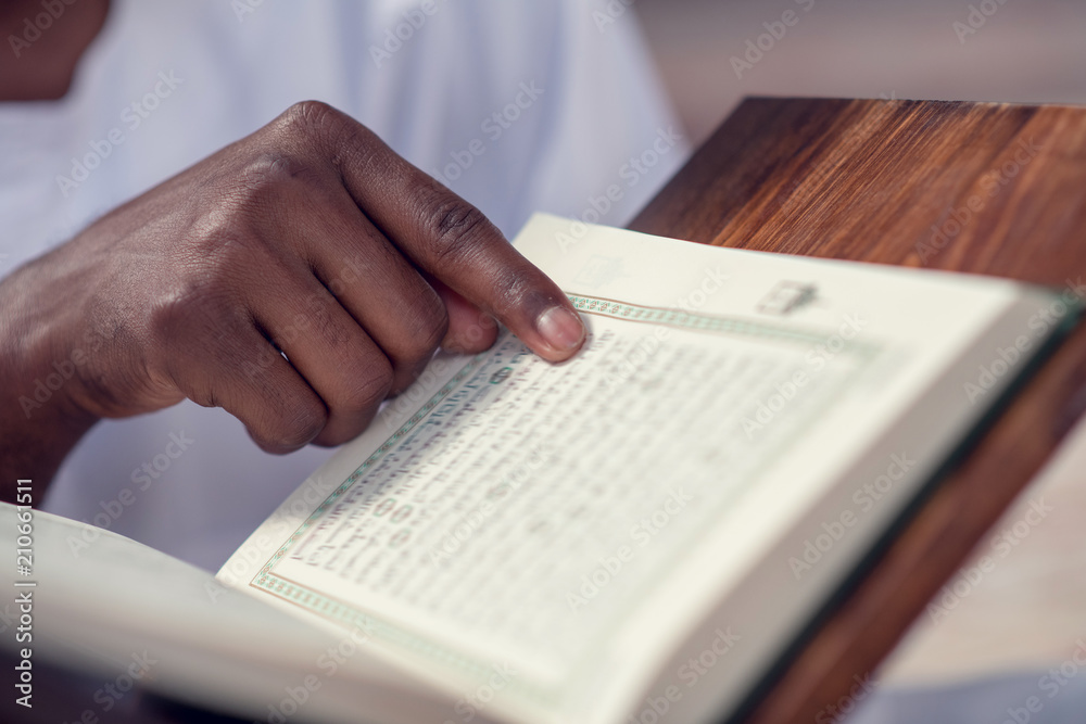 Fototapeta premium Hand of muslim black man people praying with mosque interior background