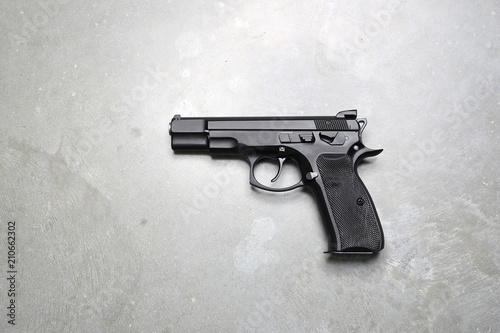 Obraz na płótnie Pistolet na szarym tle.