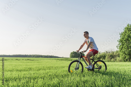 The man is riding a bicycle