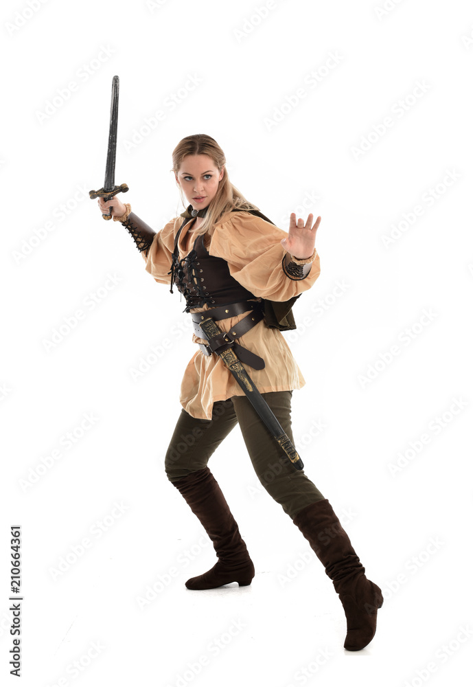 full length portrait of girl wearing brown medieval costume,. standing pose, isolated on white studio background. full length portrait of girl wearing brown medieval costume,. standing pose, isolated on white studio background.