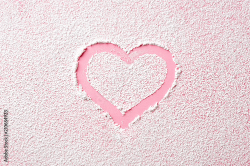 Pink heart in powder sugar