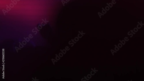 People dancing at a party in neon lights of light devices