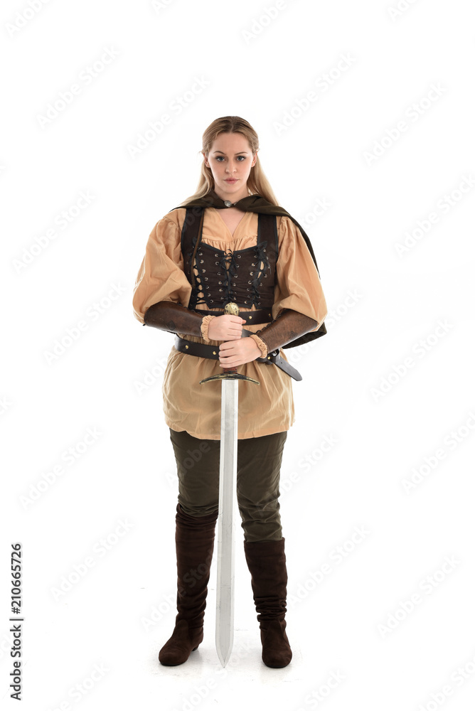 full length portrait of girl wearing brown medieval costume,. standing pose, isolated on white studio background. full length portrait of girl wearing brown medieval costume,. standing pose, isolated on white studio background.