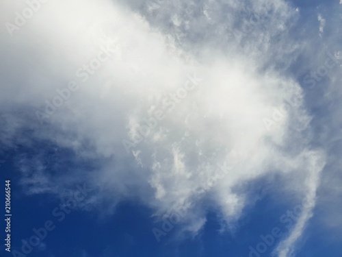 Beautiful nature of blue sky and clouds with the sun shining, sky background, cloudscape concept. Space for text in template, Empty, Looking up