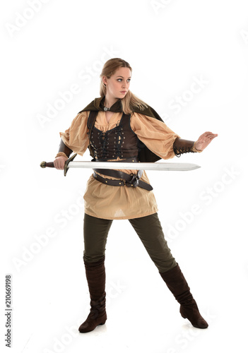 full length portrait of girl wearing brown medieval costume,. standing pose, isolated on white studio background.
