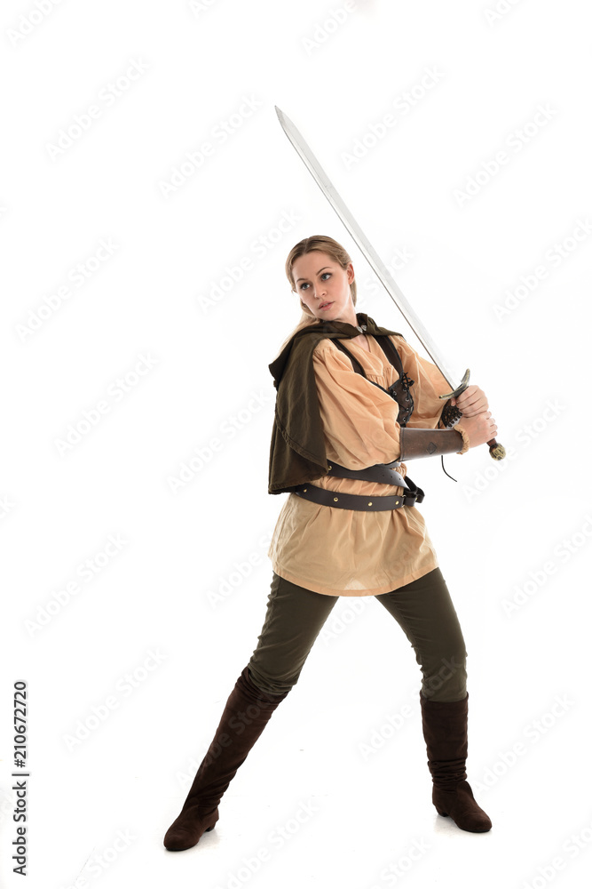 full length portrait of girl wearing brown medieval costume,. standing pose, isolated on white studio background. full length portrait of girl wearing brown medieval costume,. standing pose, isolated on white studio background.