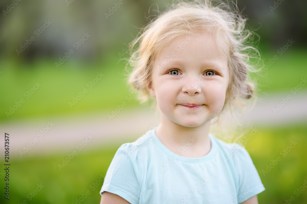 Cute toddler girl outdoors portrait in summer day Cute toddler girl outdoors portrait in summer day