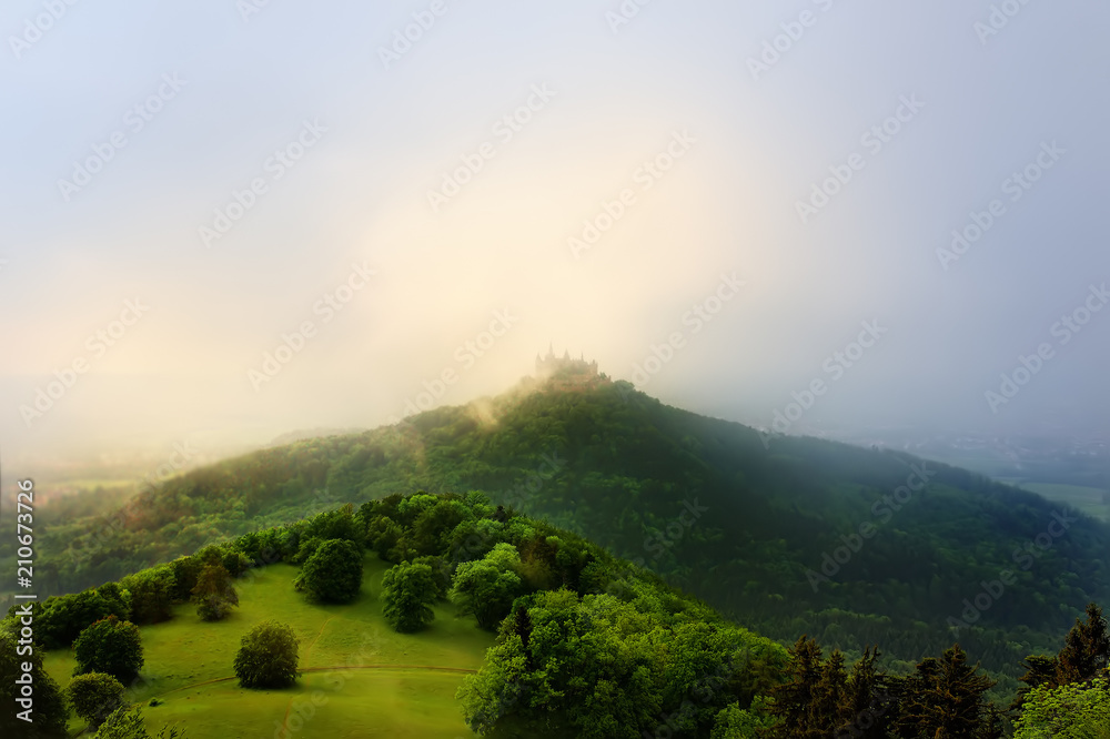 Aerial view of famous Hohenzollern Castle in thick fog, Germany Aerial view of famous Hohenzollern Castle in thick fog, Germany