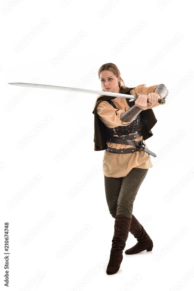 full length portrait of girl wearing brown medieval costume,. standing pose, isolated on white studio background. full length portrait of girl wearing brown medieval costume,. standing pose, isolated on white studio background.