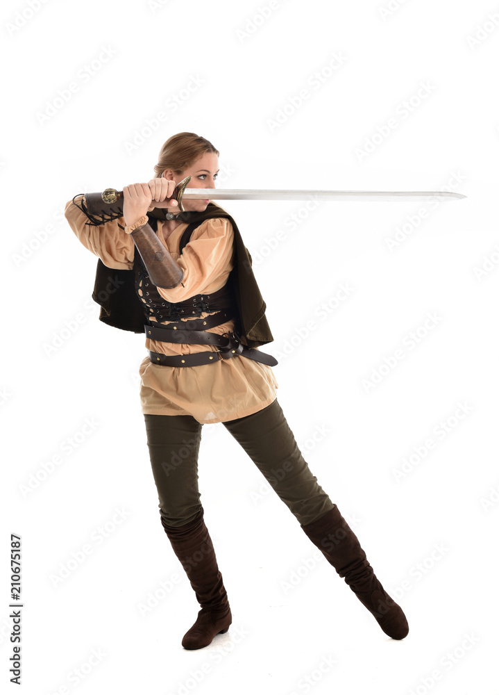 full length portrait of girl wearing brown medieval costume,. standing pose, isolated on white studio background. full length portrait of girl wearing brown medieval costume,. standing pose, isolated on white studio background.
