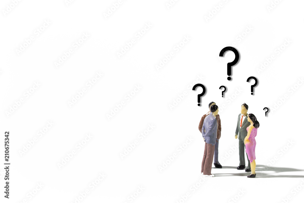 A small group of miniature businessman stand meeting searching answer on white background. A small group of miniature businessman stand meeting searching answer on white background.