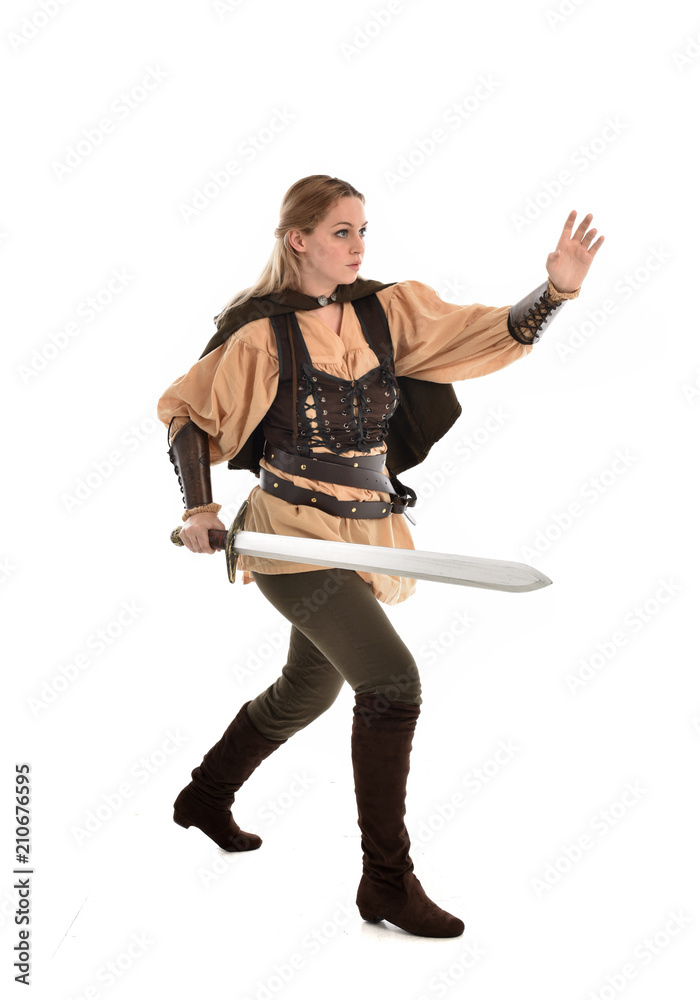 full length portrait of girl wearing brown medieval costume,. standing pose, isolated on white studio background. full length portrait of girl wearing brown medieval costume,. standing pose, isolated on white studio background.