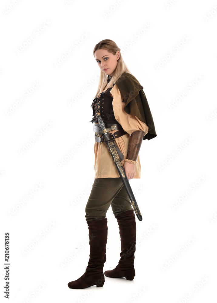 full length portrait of girl wearing brown medieval costume,. standing pose, isolated on white studio background.