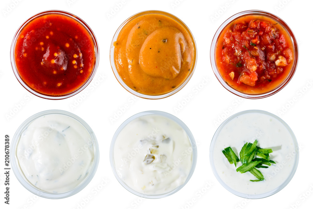 Set of different delicious sauces for dishes isolated on white b Set of different delicious sauces for dishes isolated on white b