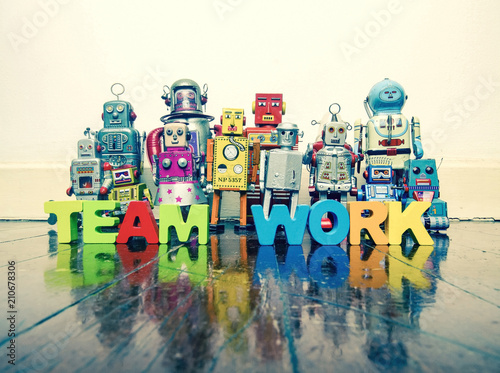 a team of vintage robots with the word TEAM WORK