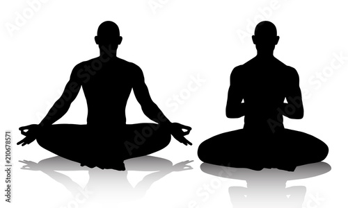 Silhouttes of men practicing yoga in the lotus position