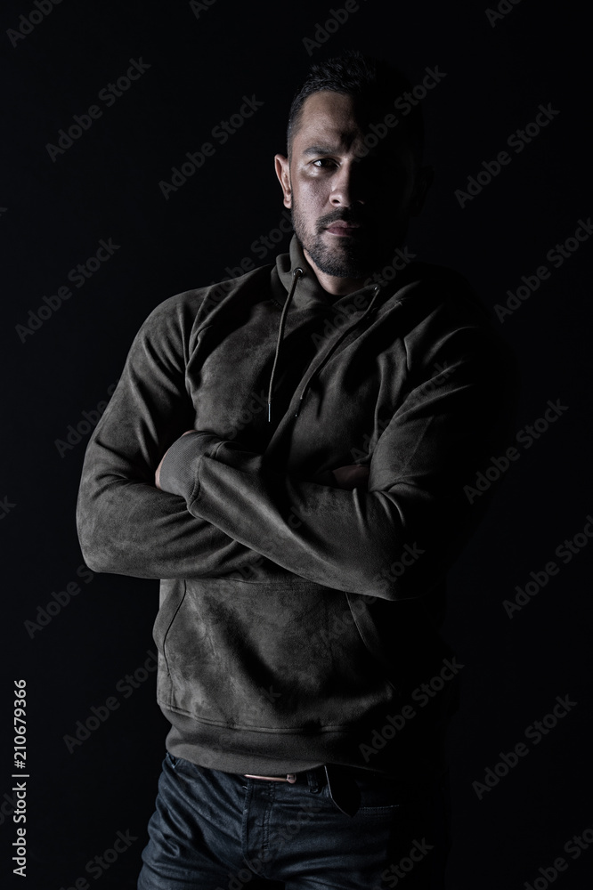 Macho with beard wear casual clothes. Bearded man with hands folded in sweatshirt. Fashion model in stylish sportswear. Lifestyle for active and healthy man. Sport fashion and style, vintage filter Macho with beard wear casual clothes. Bearded man with hands folded in sweatshirt. Fashion model in stylish sportswear. Lifestyle for active and healthy man. Sport fashion and style, vintage filter