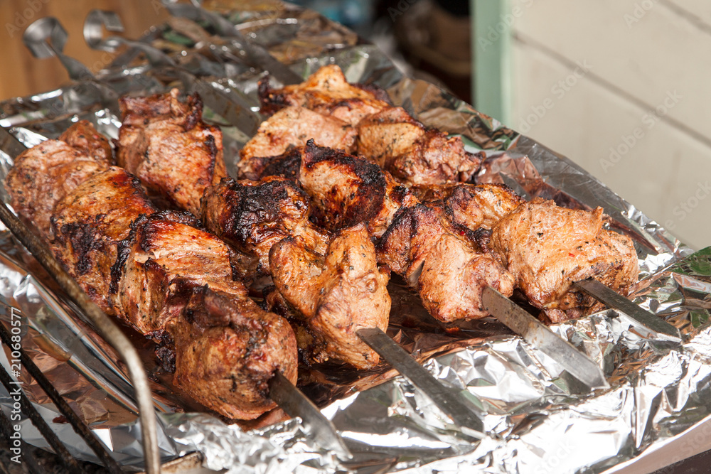 Shish kebabs cooked on the grill. BBQ street food