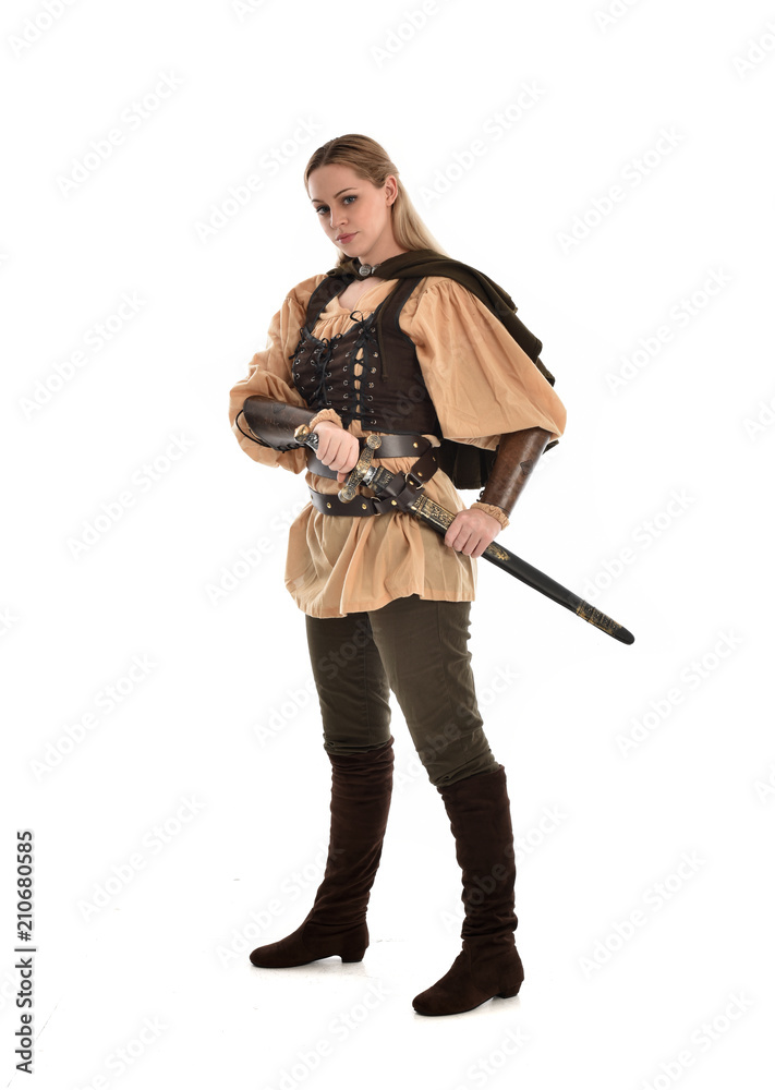 full length portrait of girl wearing brown medieval costume,. standing pose, isolated on white studio background. full length portrait of girl wearing brown medieval costume,. standing pose, isolated on white studio background.