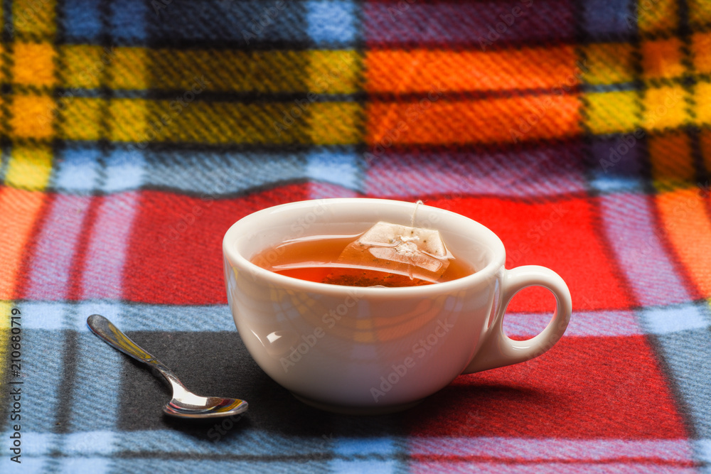 Mug filled with hot water and dipped bag of tea. Tea brew concept. Mug ...