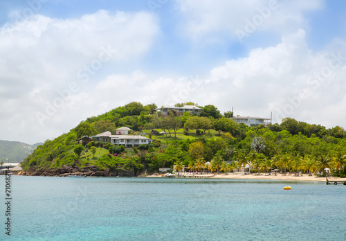 Antigua, Caribbean islands. English Harbour view with Galeon beach, sun beds and umbrellas