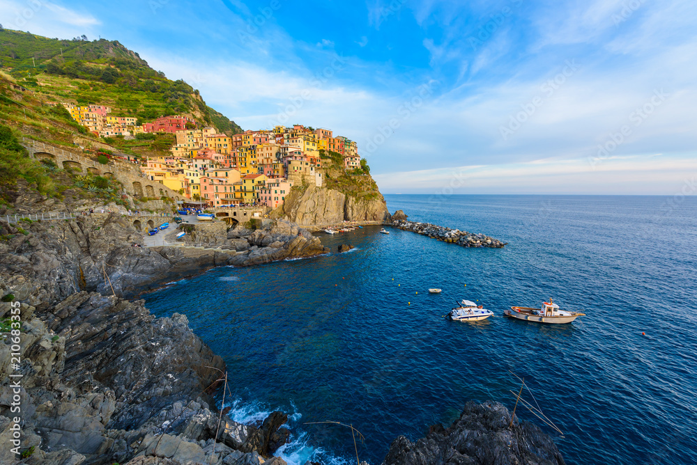 Manarola - Village of Cinque Terre National Park at Coast of Italy. Beautiful colors at sunset. Province of La Spezia, Liguria, in the north of Italy - Travel destination and attractions in Europe.