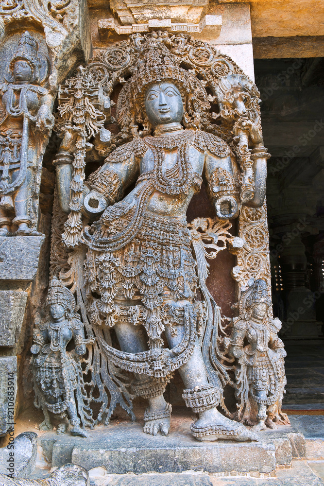 Close up of dwarapala on the left side at the North entrance of Shantaleswara shrine, Hoysaleshvara Temple, Halebid, Karnataka