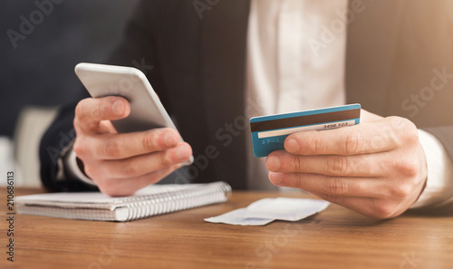 Man making online shopping by smartphone