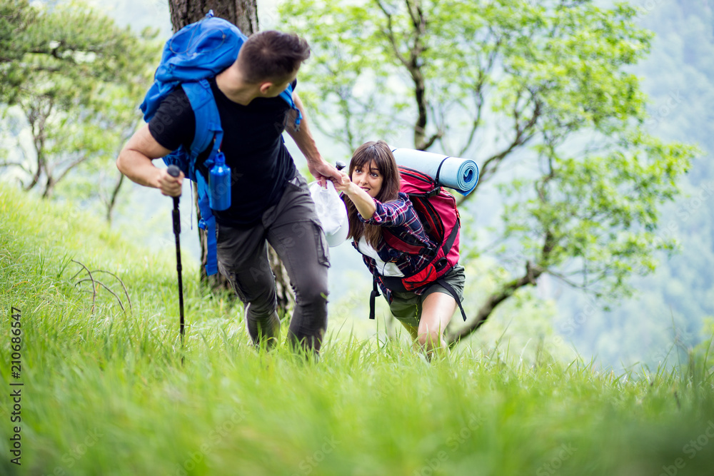 Fototapeta premium Couple enjoying on their hiking trip.Travel and adventure concept