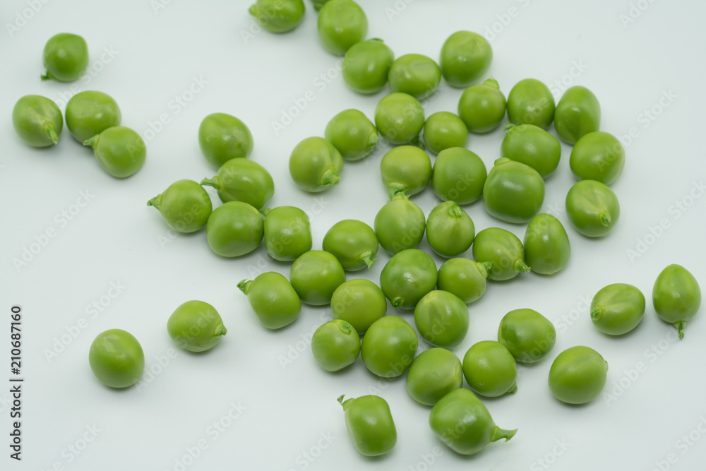 Fresh harvest green peas from my garden on white background Fresh harvest green peas from my garden on white background