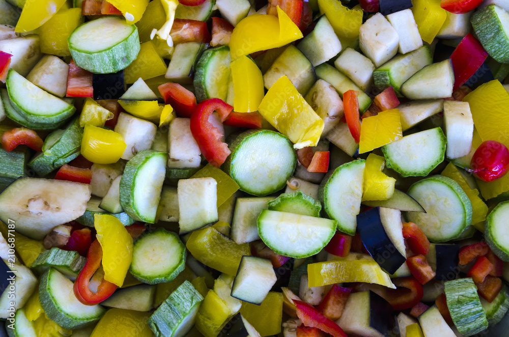 Close up of a colorful group of  fresh, raw chopped vegetables. Top view, natural light