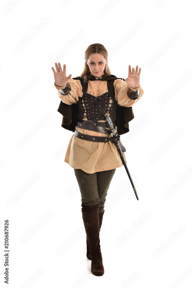 full length portrait of girl wearing brown medieval costume,. standing pose, isolated on white studio background. full length portrait of girl wearing brown medieval costume,. standing pose, isolated on white studio background.