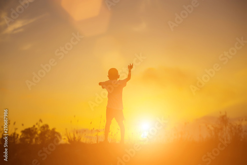 kid silhouette,Moments of the child's joy. On the Nature sunset