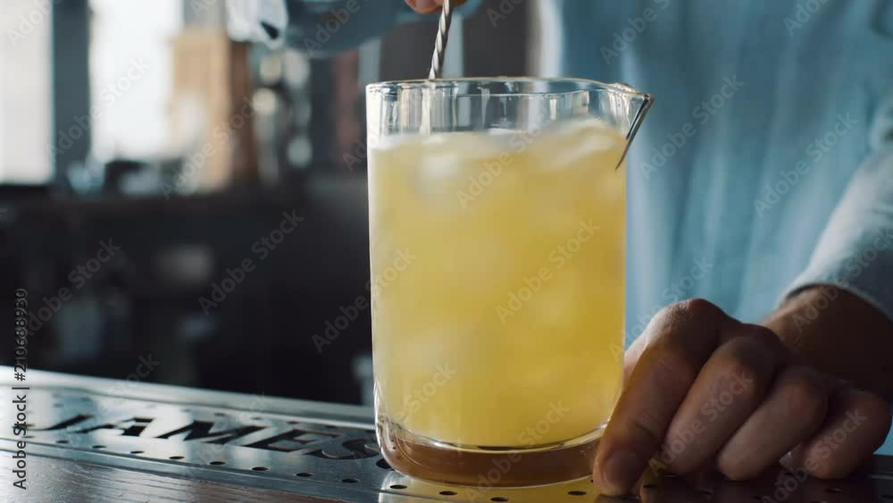 Bartender is stirring cocktails on the bar Bartender is stirring cocktails on the bar