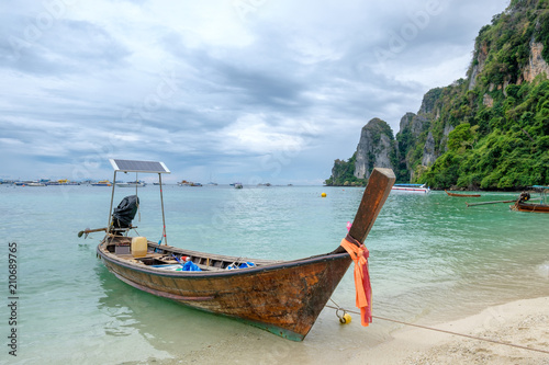 Wooden long tail boat anchored on phi phi island