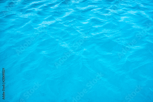 Wave ripple turquoise blue surface of pool © Mumemories