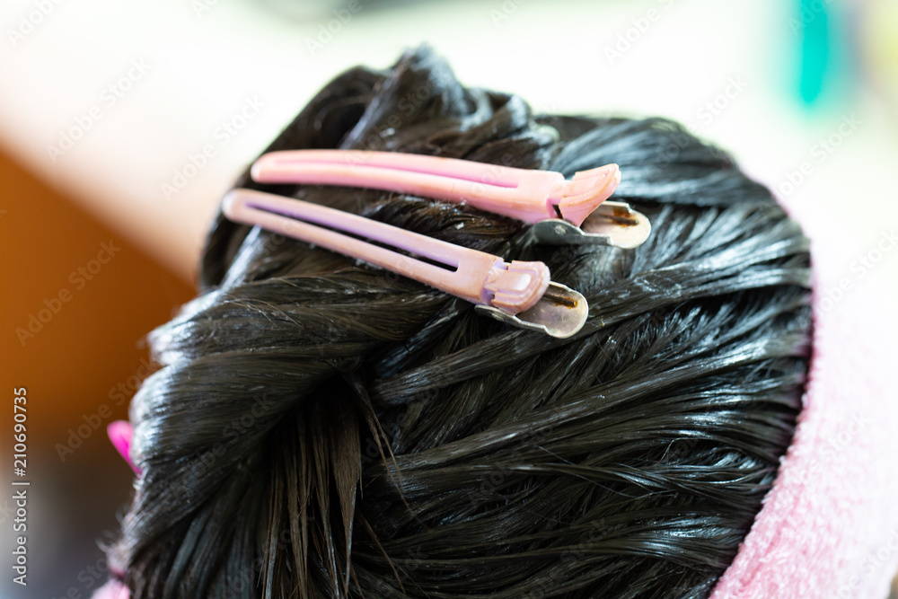 Naklejka premium Background of Barber supplies, applying color cream at hair in salon.