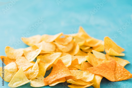 nacho chips food crisp slices blue background